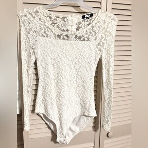 Blouse. White. Lace. Chiffon. With buttons in the back. And snaps at the bottom.